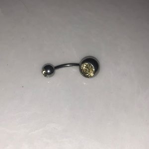 Pale yellow belly button ring !